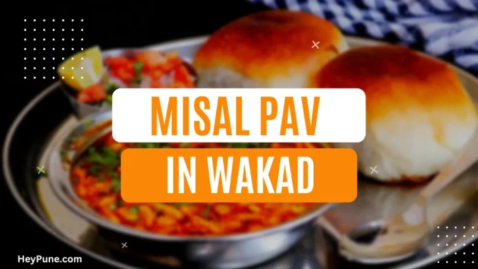 A plate of Misal Pav with garnishes on top, served at a restaurant in Wakad